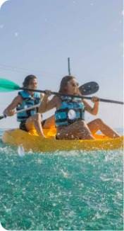 A couple having a ride in kayak in Isla Mujeres