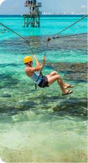 Woman riding the zip line on Garrafon Park